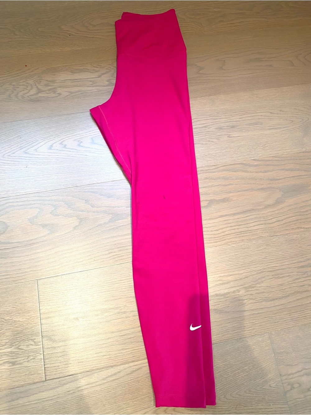 Nike Training One Dri-Fit mid rise leggings in fireberry pink - no pulling.